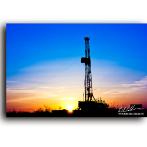 In this full image of sunset and a rig, it has a shadowy presents. Serenity by Bob Callender